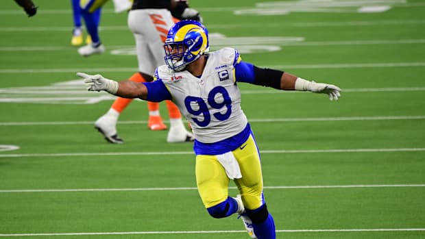 Feb 13, 2022; Inglewood, California, USA; Los Angeles Rams defensive tackle Aaron Donald (99) celebrates after a pressure in the fourth quarter against the Cincinnati Bengals in Super Bowl LVI at SoFi Stadium. Mandatory Credit: Gary A. Vasquez-USA TODAY Sports